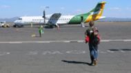 Josh walking to the plane at Kilimanjaro International Airport